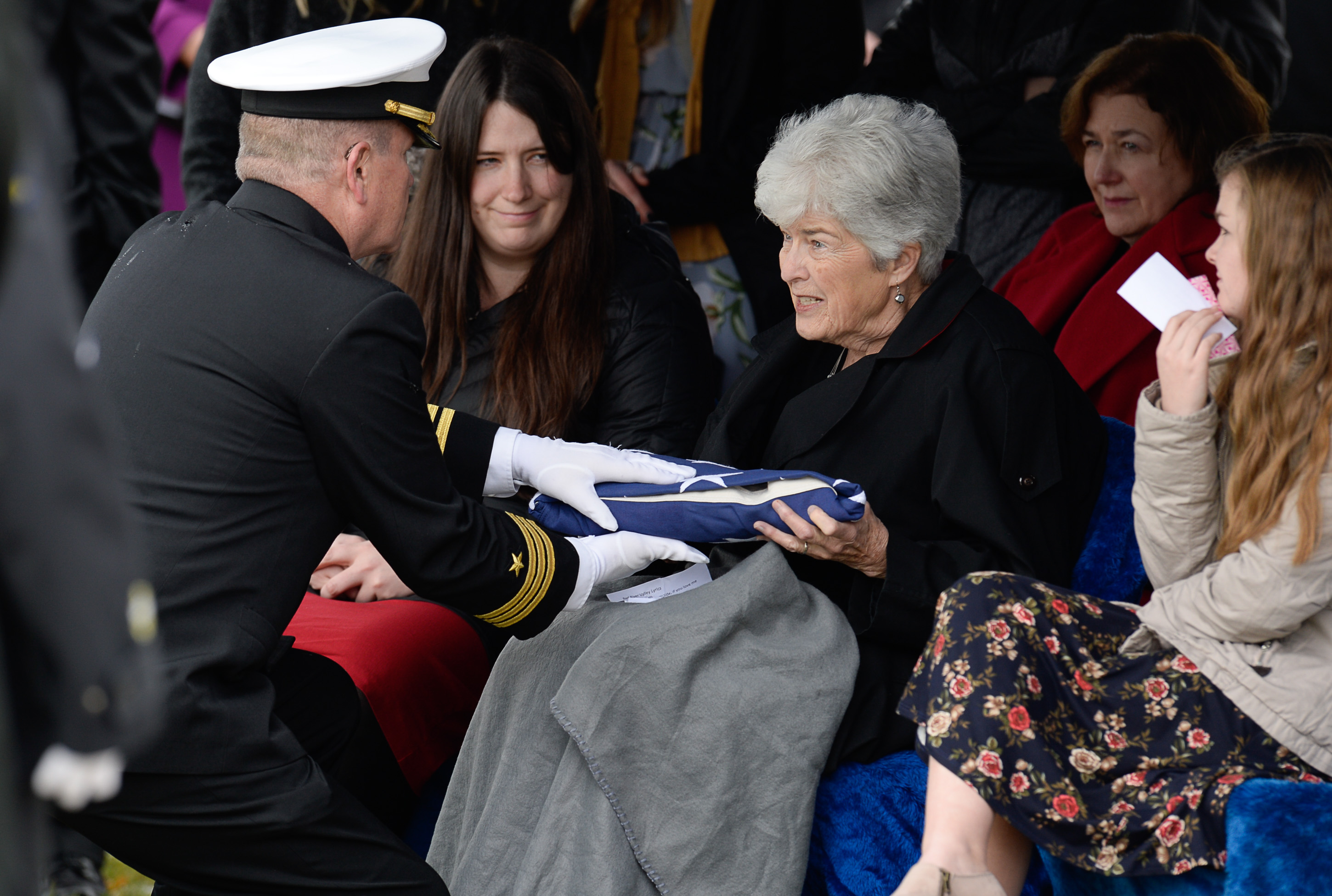 (Francisco Kjolseth | The Salt Lake Tribune) Commander Cory Baggs presents former congressman Jim Hansen's wife Ann with the flag at the Farmington City Cemetery, Saturday, Nov. 24, 2018.