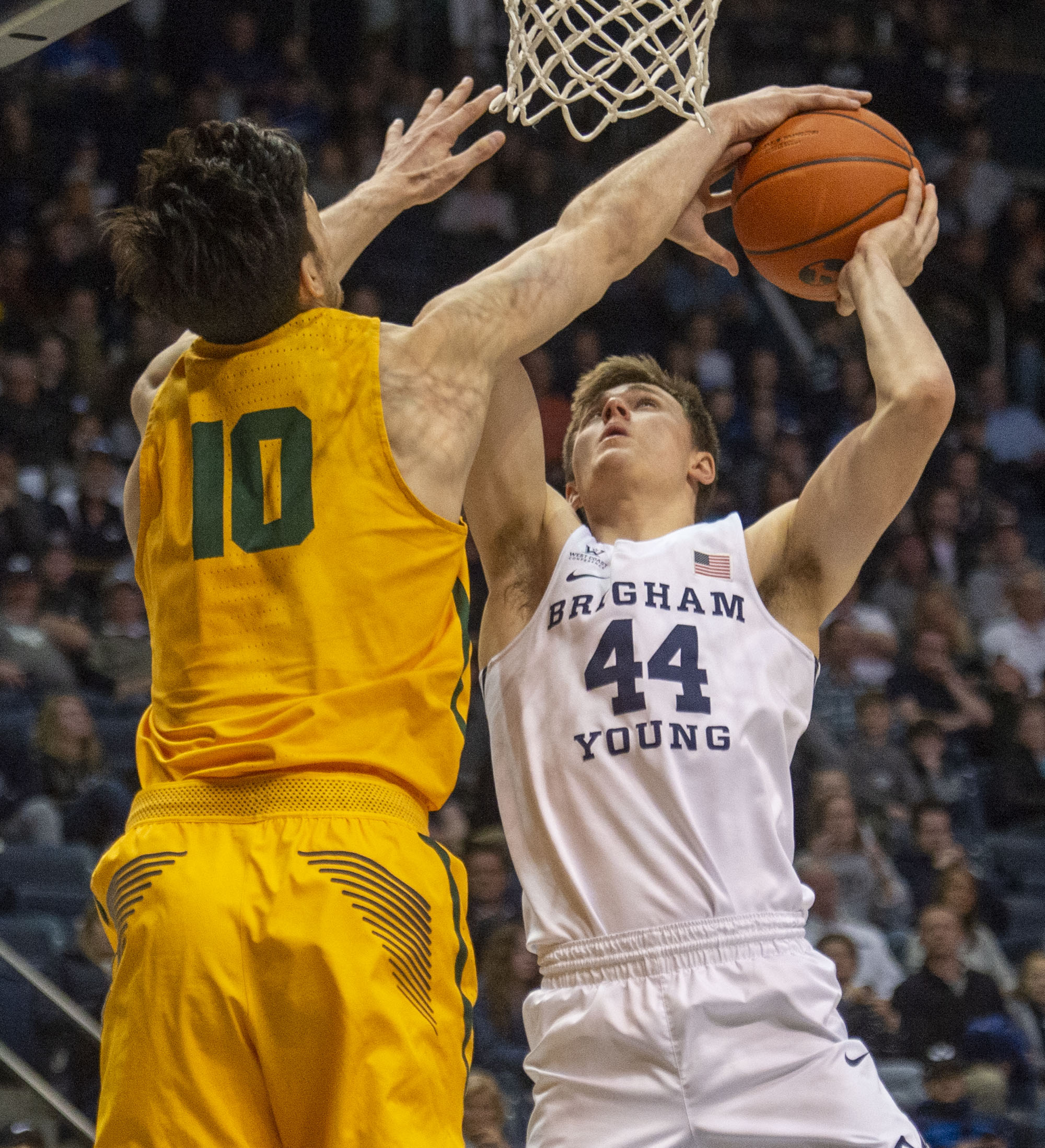 (Rick Egan | The Salt Lake Tribune) San Francisco Dons forward Matt McCarthy (10) blocks a shot by Brigham Young Cougars guard Connor Harding (44), in WCC basketball action between Brigham Young Cougars and San Francisco Dons, at the Marriott Center, Thursday, February 21, 2018. 