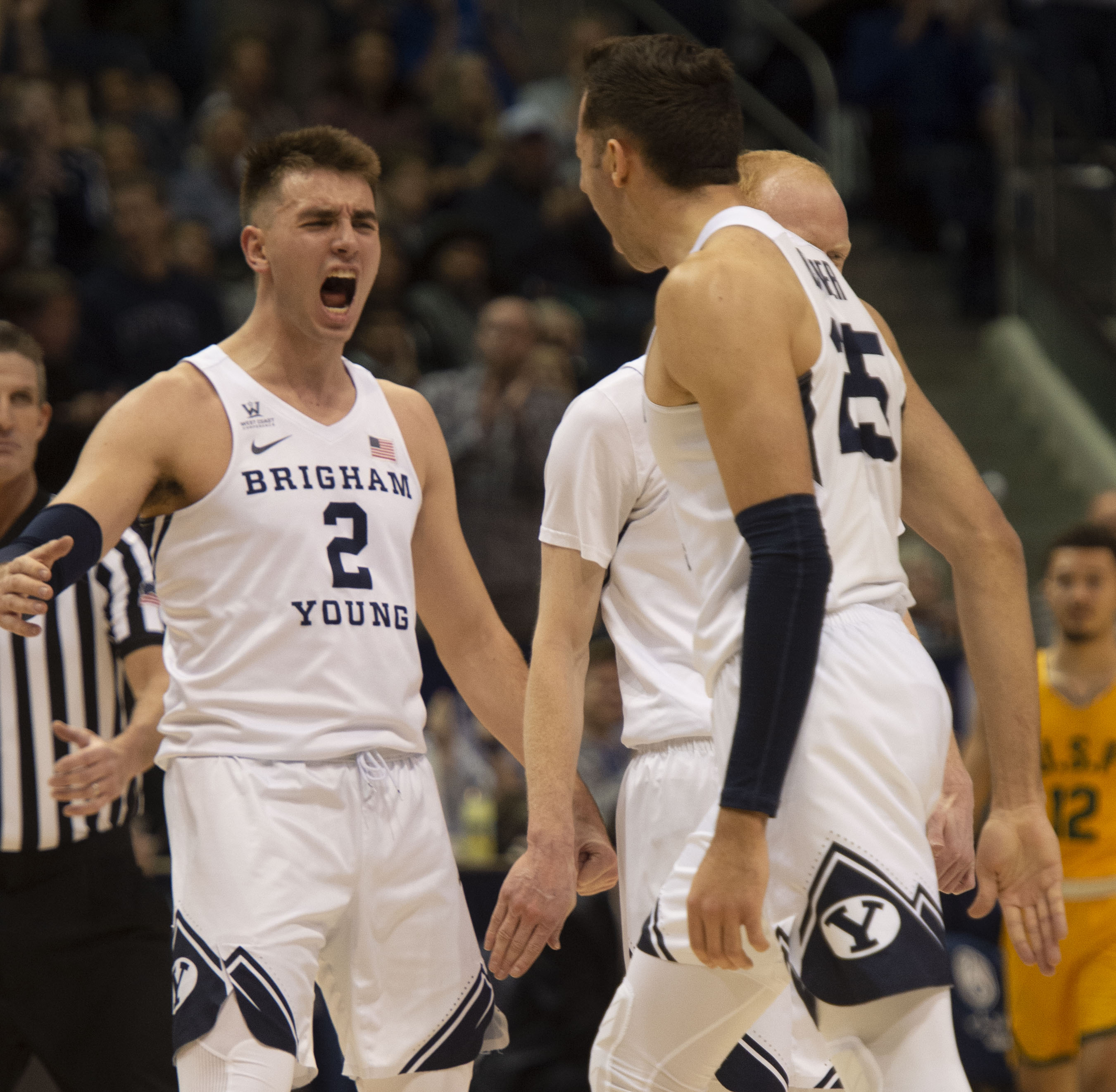(Rick Egan | The Salt Lake Tribune) Brigham Young guard Zac Seljaas (2) and forward Gavin Baxter (25) celebrate a big Cougar lead with 10 minutes left in the game, in WCC basketball action between Brigham Young Cougars and San Francisco Dons, at the Marriott Center, Thursday, February 21, 2018. 